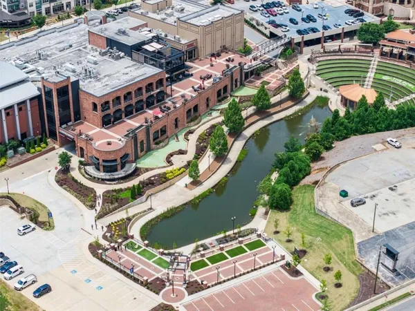 an aerial view of a house with yard swimming pool and outdoor seating