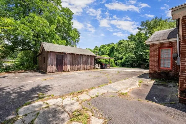 a view of a house with a yard and garage