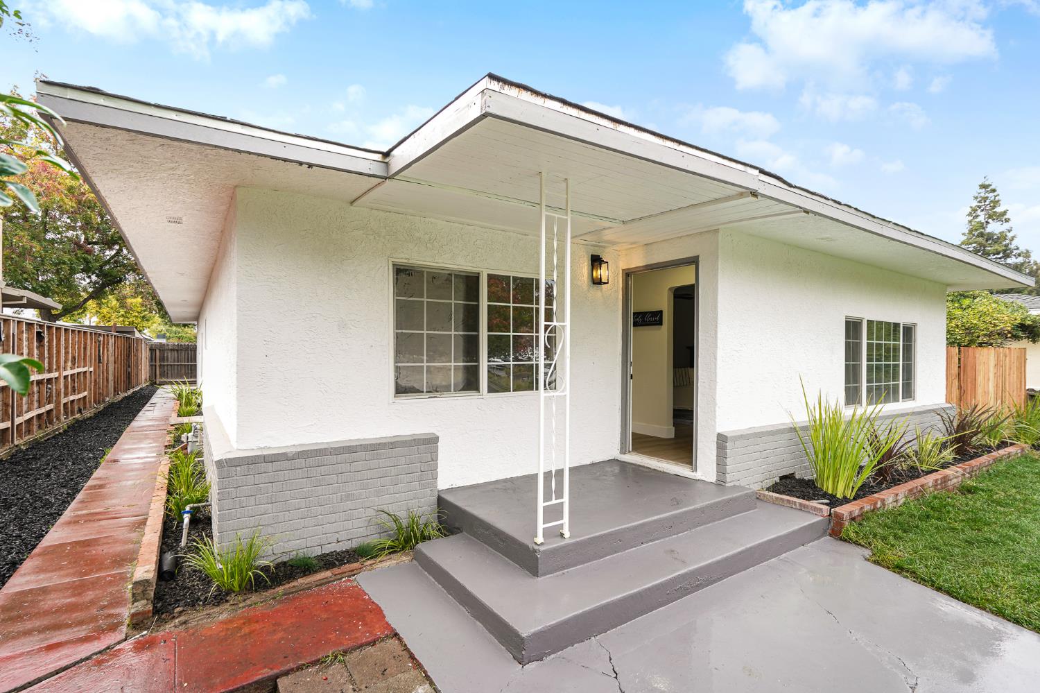 1417 Concord Avenue Modesto, CA 95350 - Photo 2 of 40 a front view of a house with garage