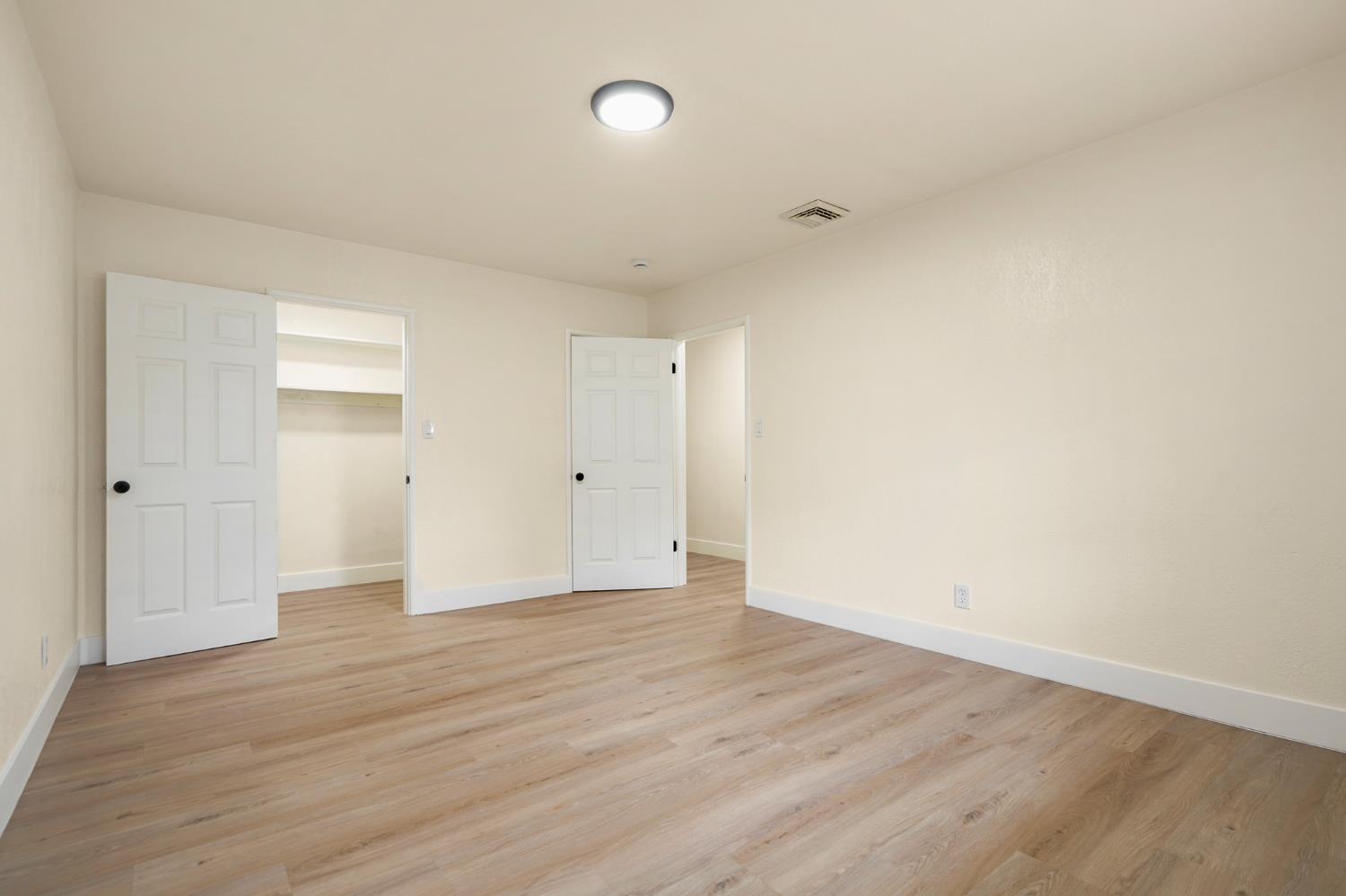 1417 Concord Avenue Modesto, CA 95350 - Photo 21 of 40 a view of an empty room with wooden floor