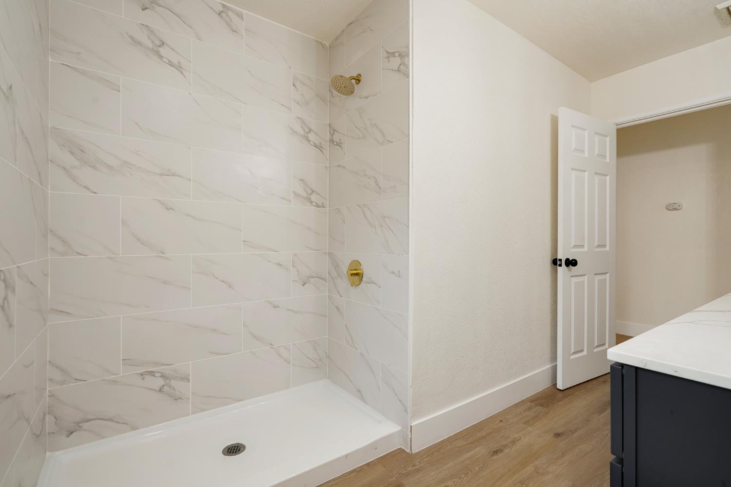 1417 Concord Avenue Modesto, CA 95350 - Photo 24 of 40 a bathroom with a tub and shower