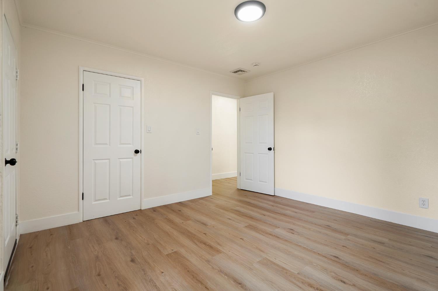 1417 Concord Avenue Modesto, CA 95350 - Photo 30 of 40 a view of an empty room with wooden floor