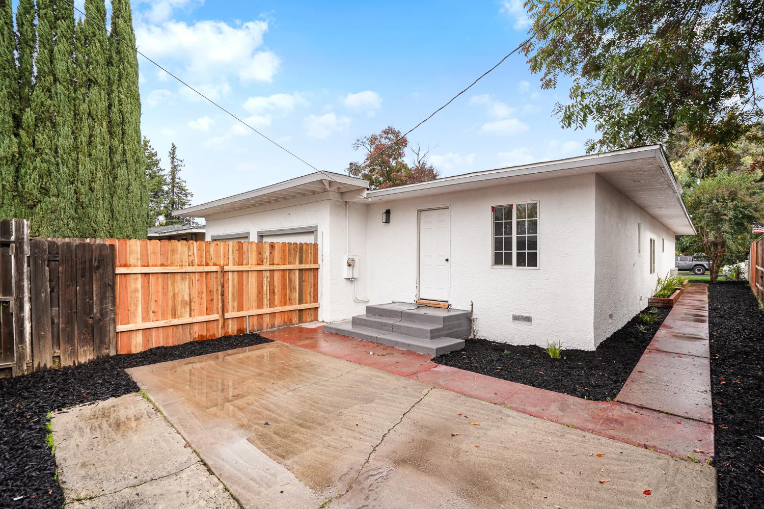 1417 Concord Avenue Modesto, CA 95350 - Photo 33 of 40 a view of a house with a yard and garage
