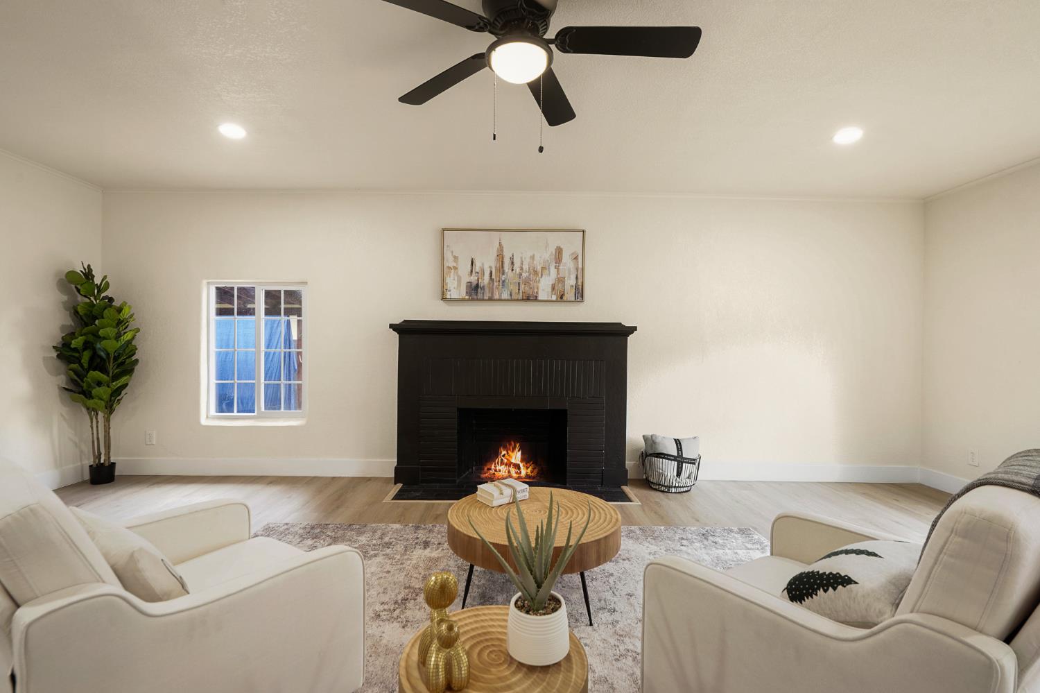 1417 Concord Avenue Modesto, CA 95350 - Photo 10 of 40 a living room with furniture and a fireplace