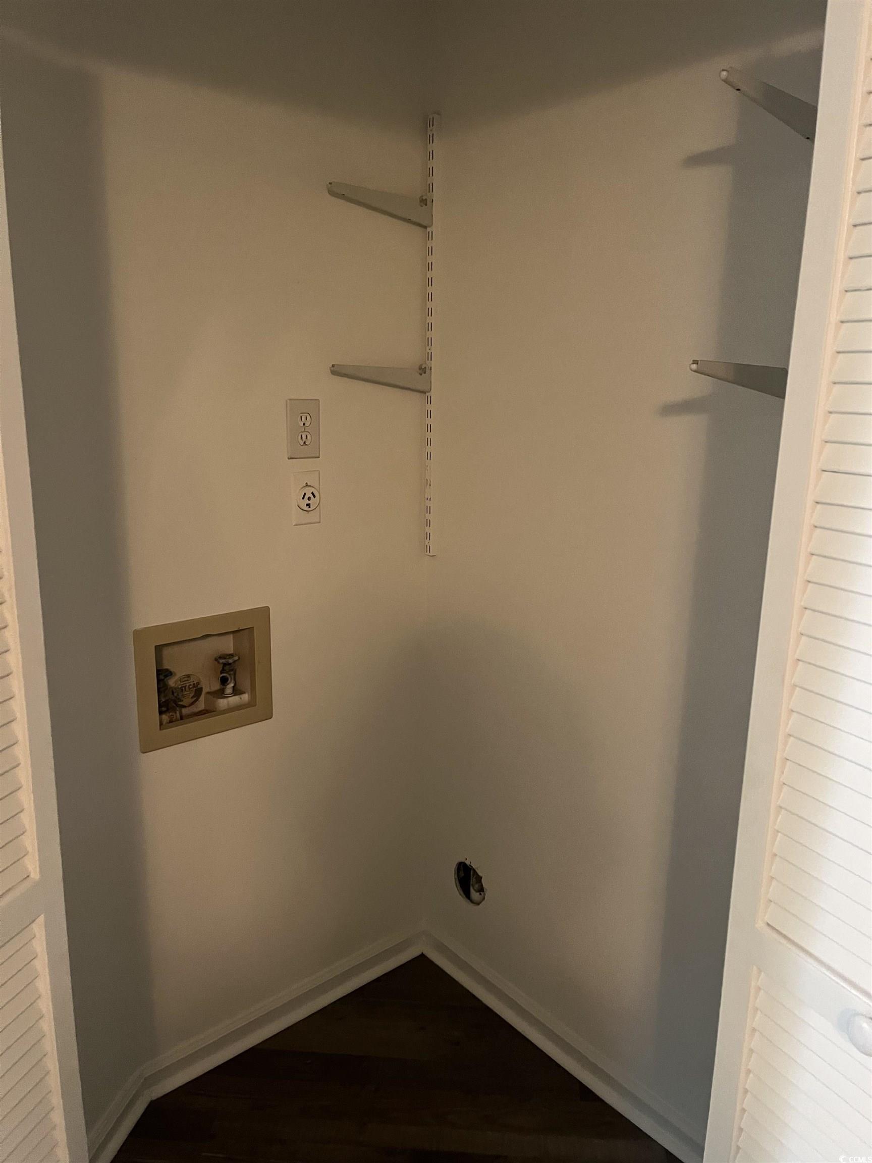 600 65th Avenue North, Unit 7 Myrtle Beach, SC 29572 - Photo 12 of 29 Washroom featuring washer hookup and dark wood-type flooring