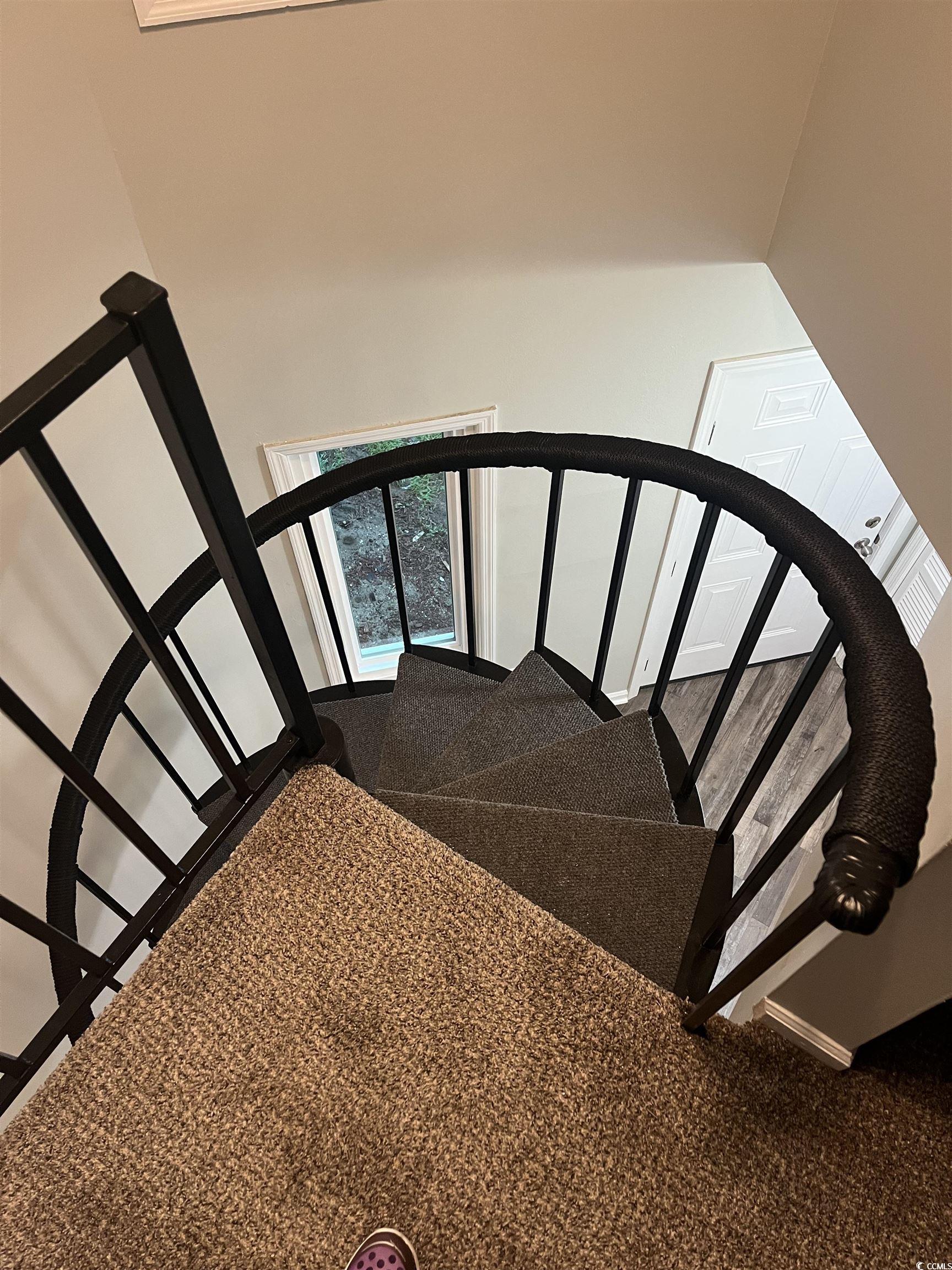600 65th Avenue North, Unit 7 Myrtle Beach, SC 29572 - Photo 13 of 29 Stairway featuring carpet