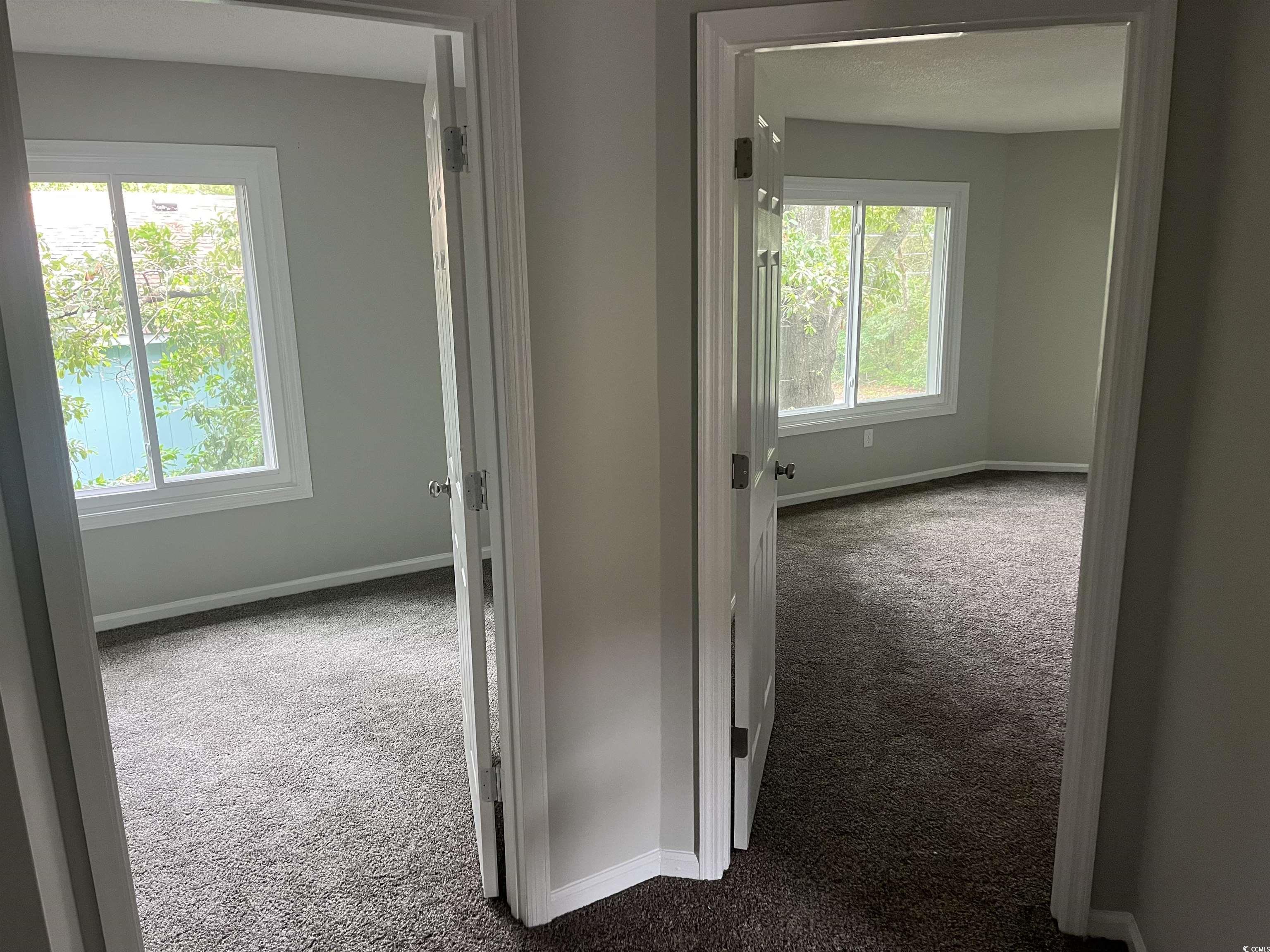 600 65th Avenue North, Unit 7 Myrtle Beach, SC 29572 - Photo 15 of 29 Corridor with baseboards and carpet