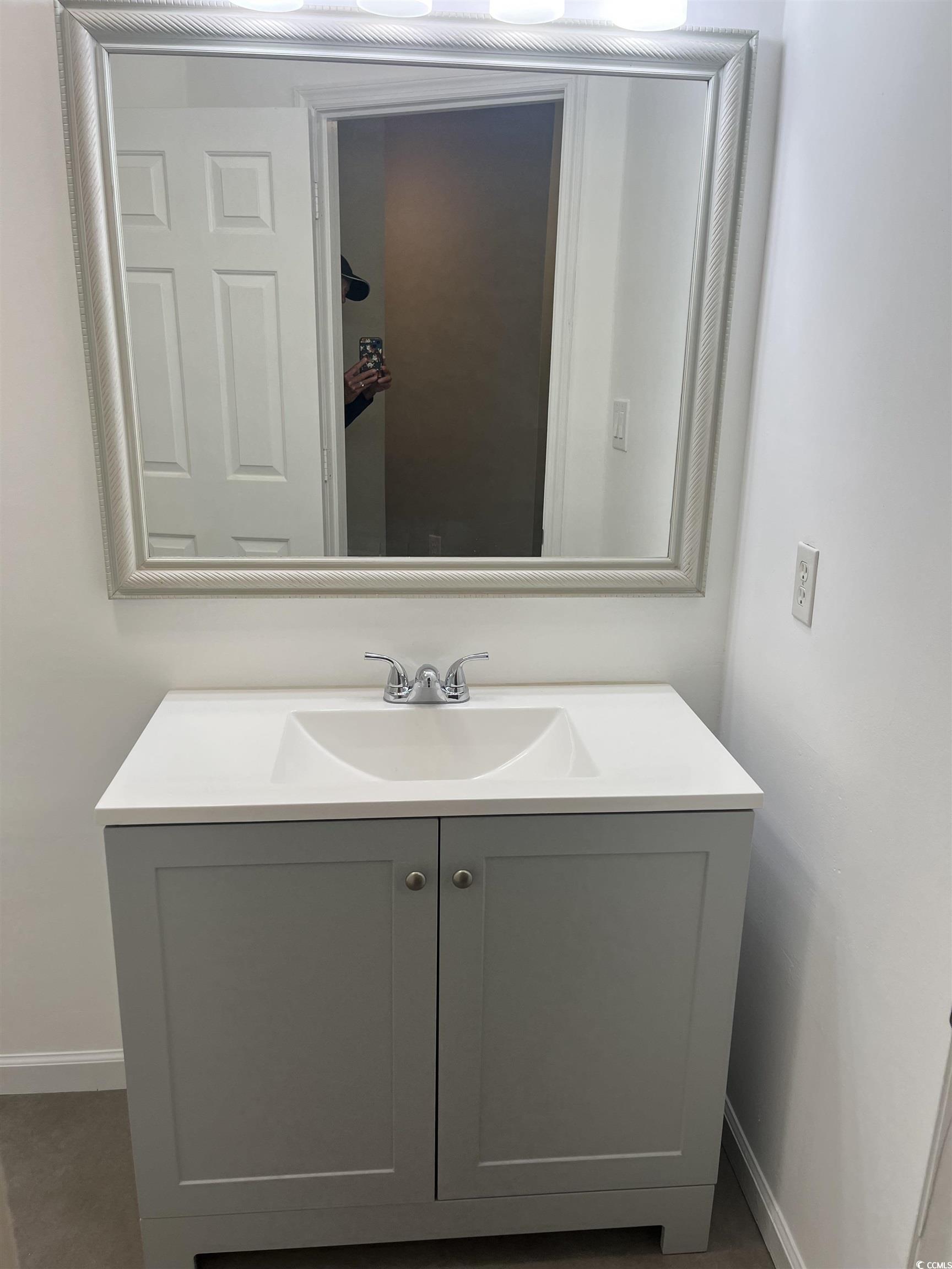 600 65th Avenue North, Unit 7 Myrtle Beach, SC 29572 - Photo 24 of 29 Bathroom featuring vanity and baseboards