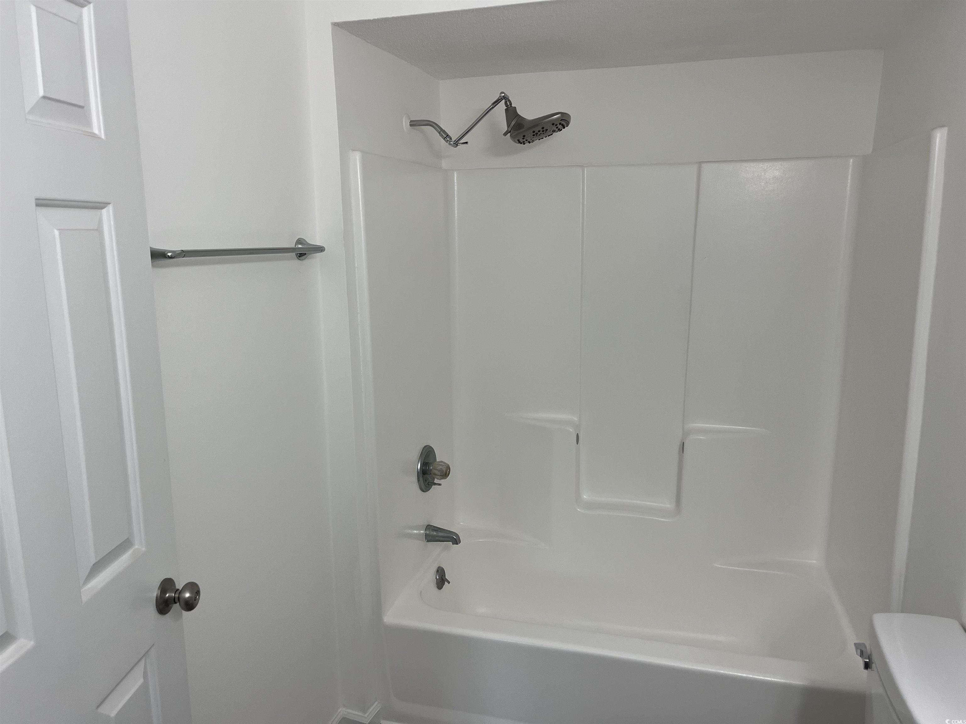 600 65th Avenue North, Unit 7 Myrtle Beach, SC 29572 - Photo 25 of 29 Bathroom featuring shower / bathtub combination and toilet