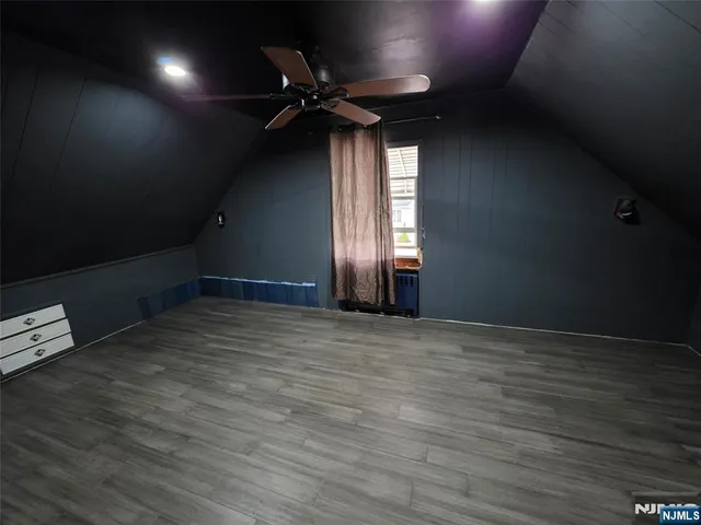 a bathroom with a sink mirror vanity and toilet