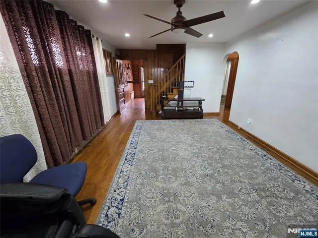 a view of an entryway with wooden floor