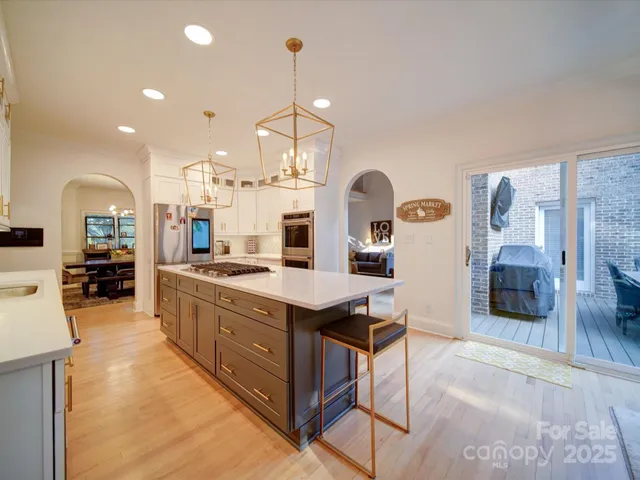 a large kitchen with a lot of counter space and a sink