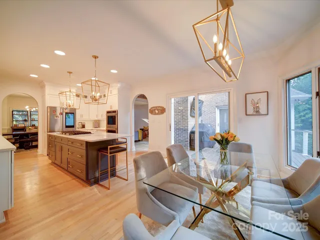 a living room with fireplace furniture and a wooden floor