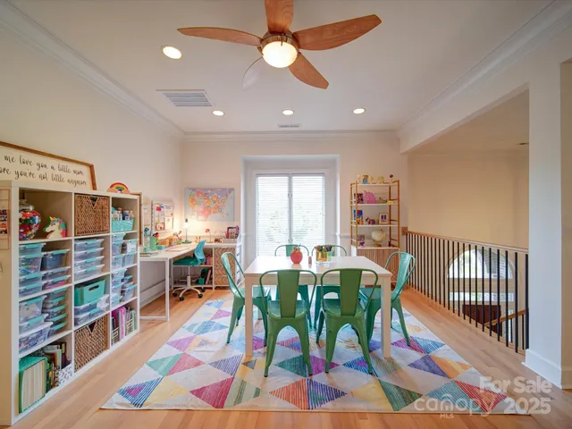 a view of a dining room with furniture and a rug