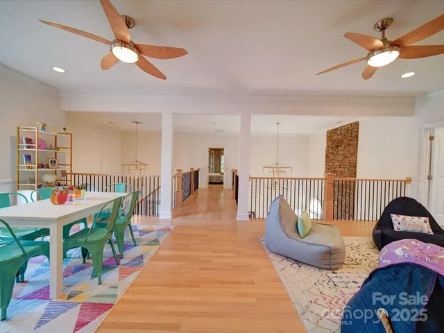 a living room with furniture a rug and a chandelier