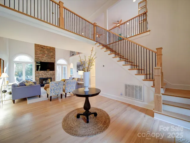 a view of entryway livingroom and hall with wooden floor