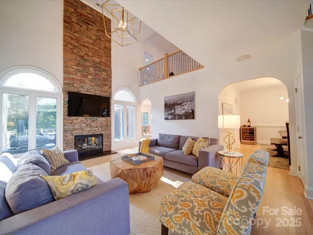 a living room with furniture fireplace and a fireplace