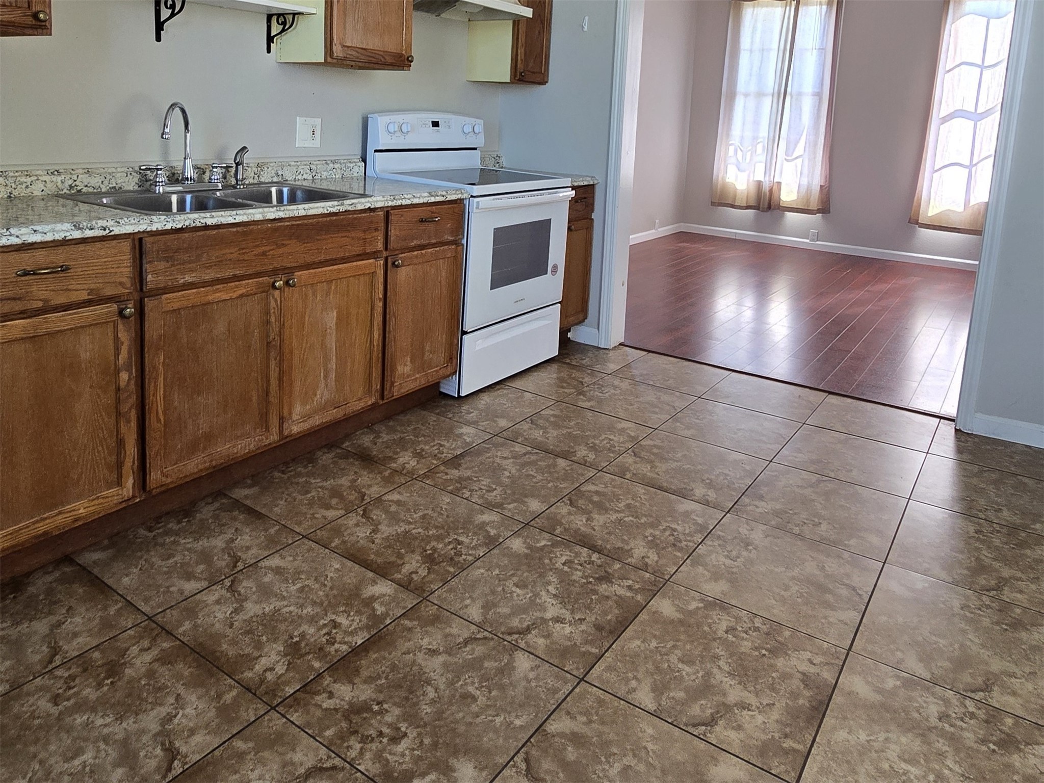 1614 Market Street, Unit 2 Galveston, TX 77550 - Photo 11 of 22 a kitchen with a sink and cabinets