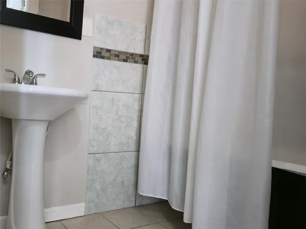a bathroom with a sink and mirror