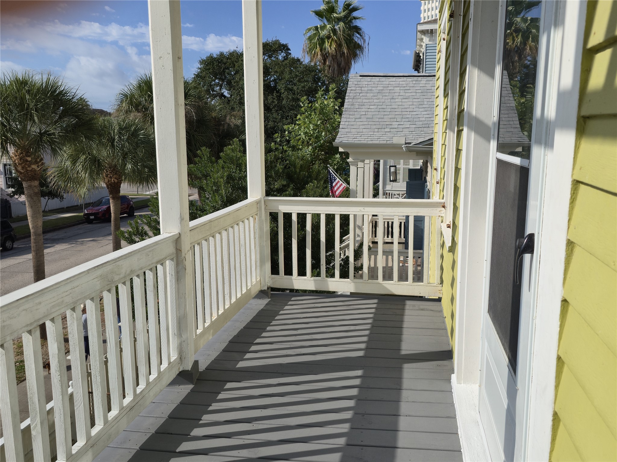 1614 Market Street, Unit 2 Galveston, TX 77550 - Photo 18 of 22 a view of a balcony with wooden floor