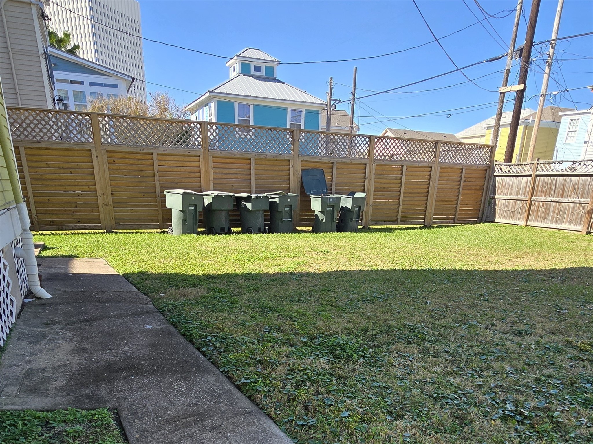 1614 Market Street, Unit 2 Galveston, TX 77550 - Photo 21 of 22 a view of a house with a yard and sitting area