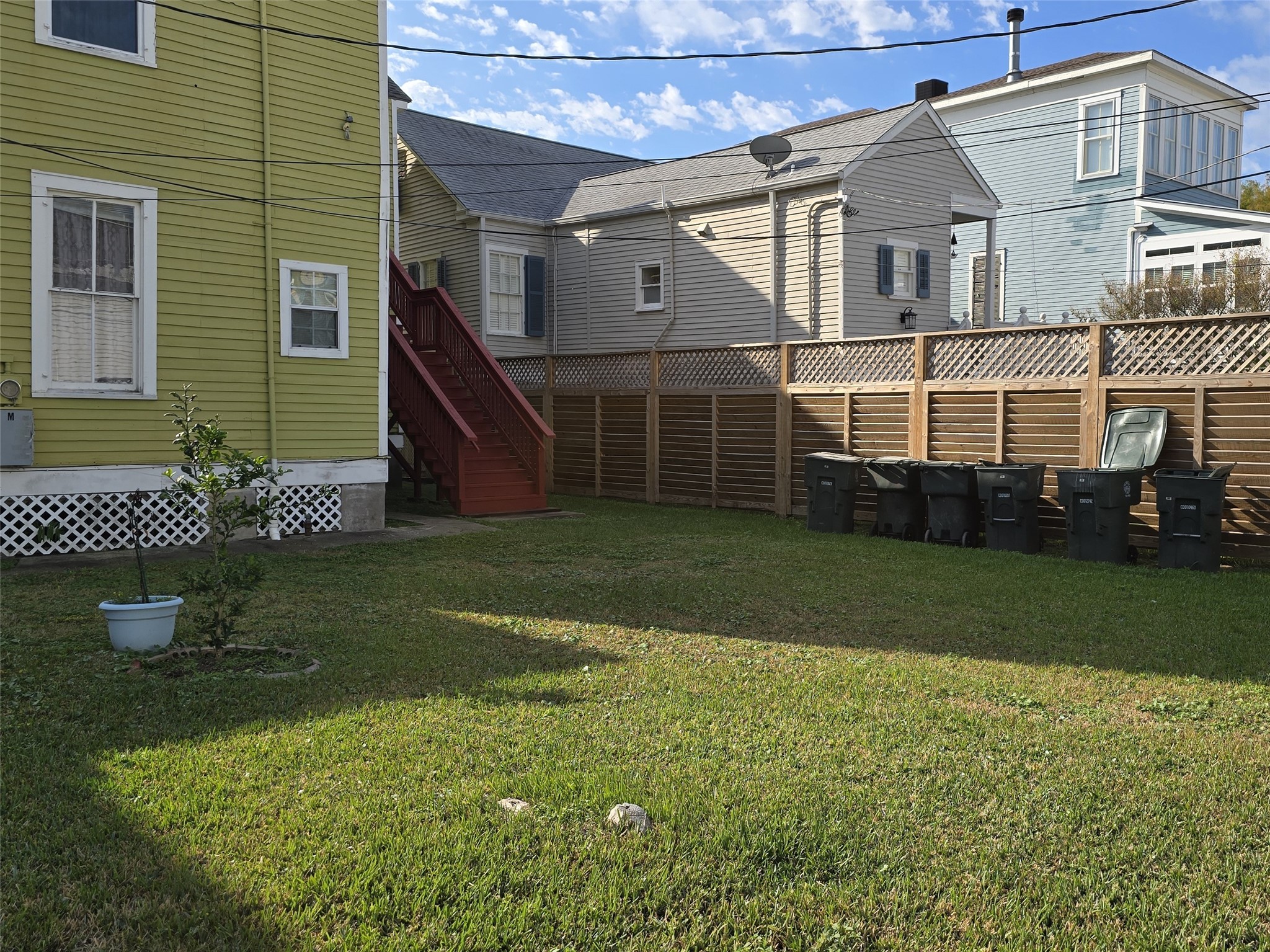 1614 Market Street, Unit 2 Galveston, TX 77550 - Photo 22 of 22 a view of a house with a yard