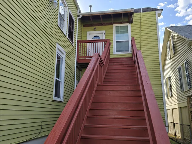 a view of entryway with wooden stairs
