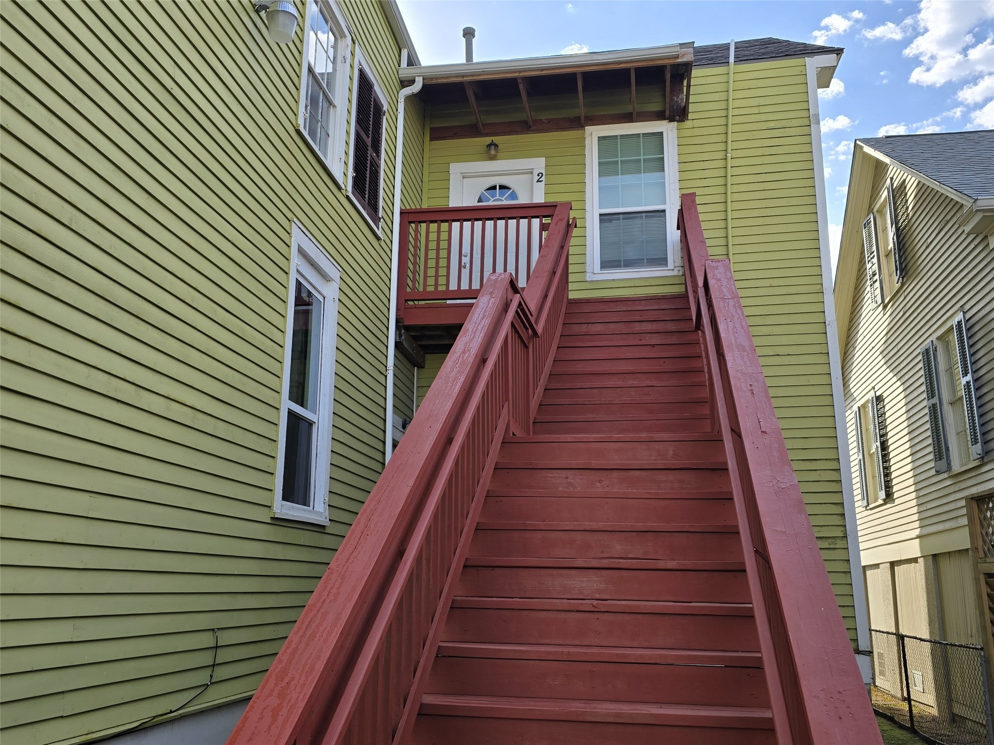 1614 Market Street, Unit 2 Galveston, TX 77550 - Photo 4 of 22 a view of entryway with wooden stairs