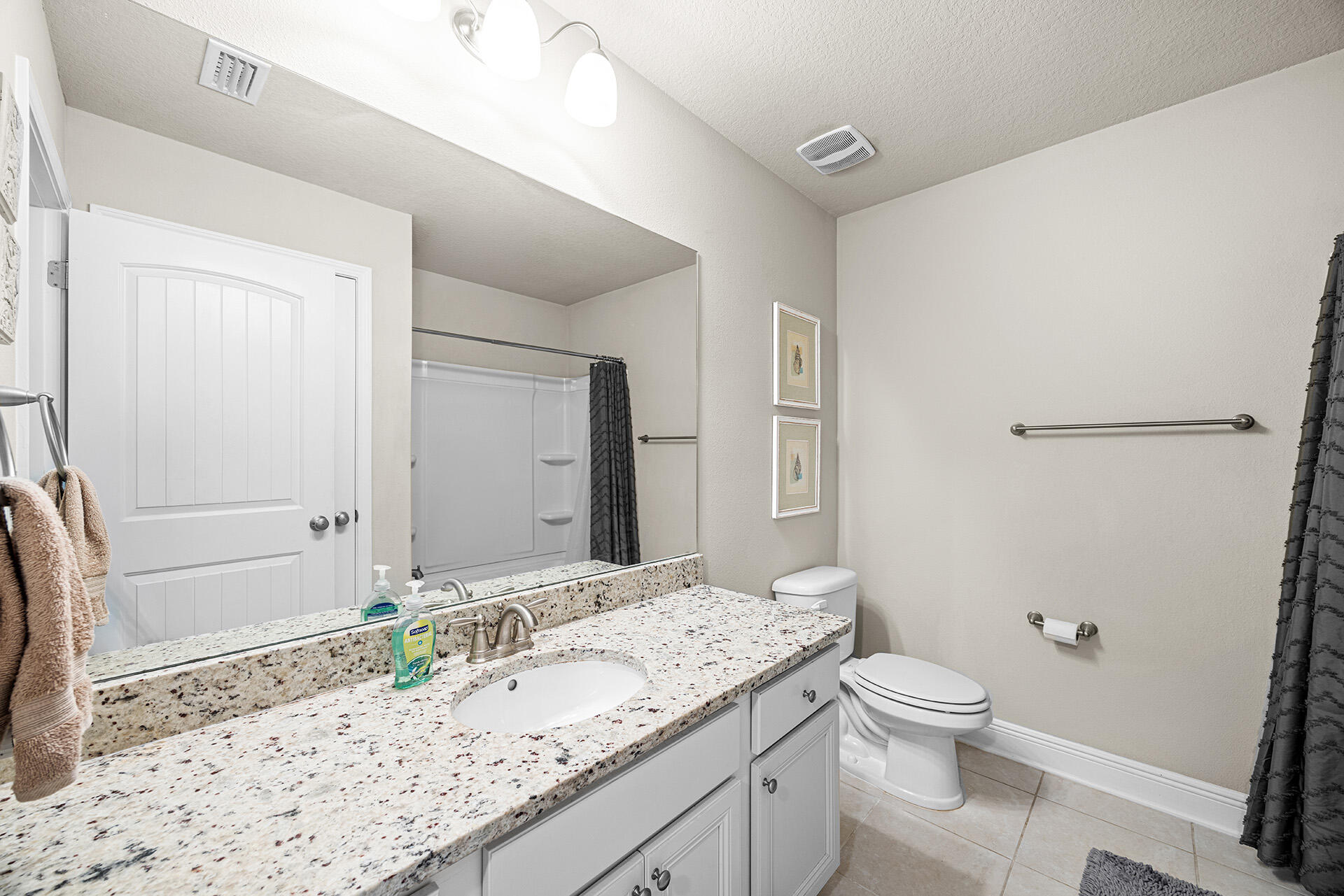 52 Tranquility Lane Santa Rosa Beach, FL 32459 - Photo 24 of 31 a bathroom with a granite countertop sink toilet and shower