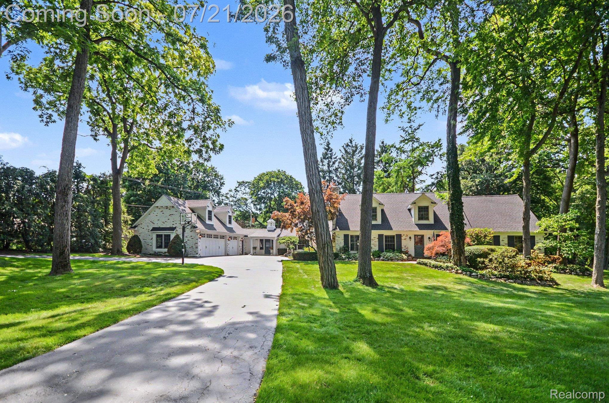 3780 Squirrel Road Bloomfield Hills, MI 48304 - Photo 50 of 59 Expansive front lawn with mature trees and a long driveway leading to the main residence and detached garage