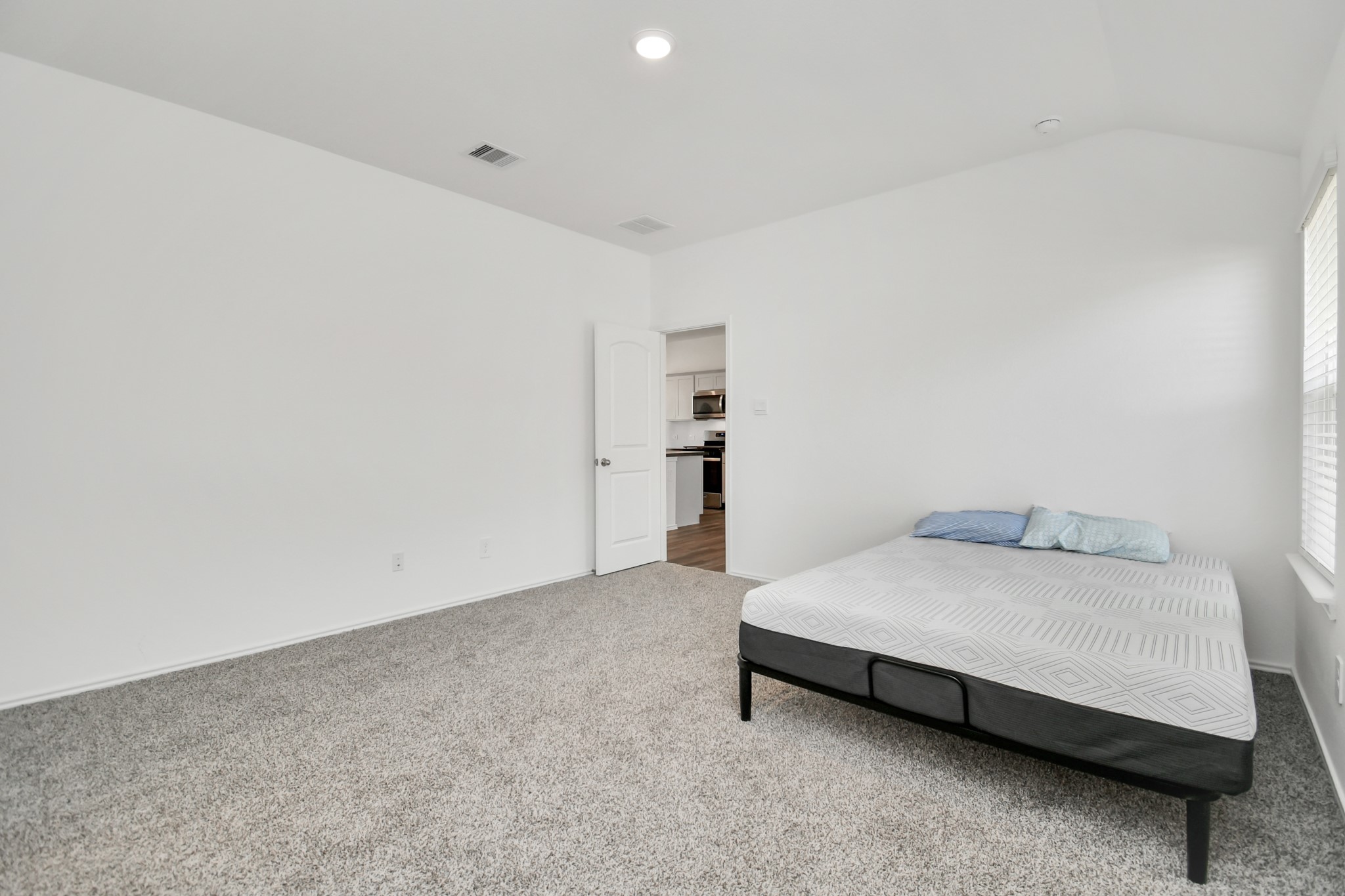 5315 Castlebury Meadows Dr Spring Spring, TX 77373 - Photo 25 of 39 a bedroom with a bed and table