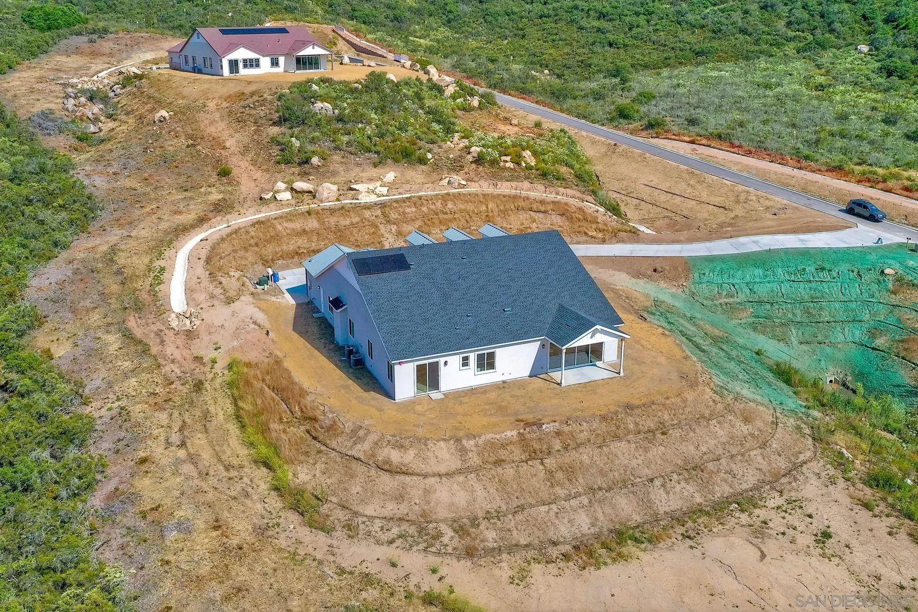 15111 Summit Trail Road Poway, CA 92064 - Photo 3 of 4 a view of a house with a yard