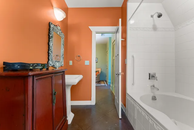 a view of an empty room with a fireplace and a large window