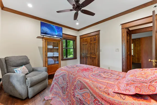 a living room with patio furniture and a floor to ceiling window