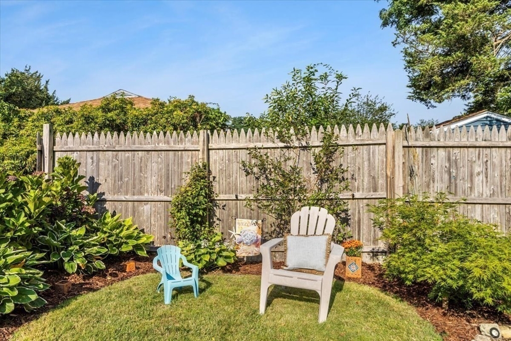 2 River Road Pocasset, MA 02559 - Photo 29 of 37 a view of a chair and table in the patio