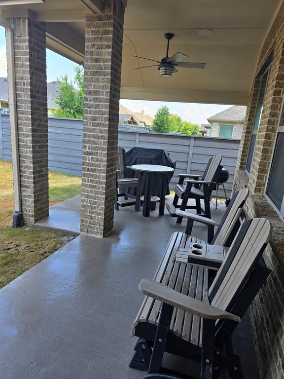 7024 Tree Stand Point Little Elm, TX 76227 - Photo 22 of 30 a view of a porch with furniture and a yard