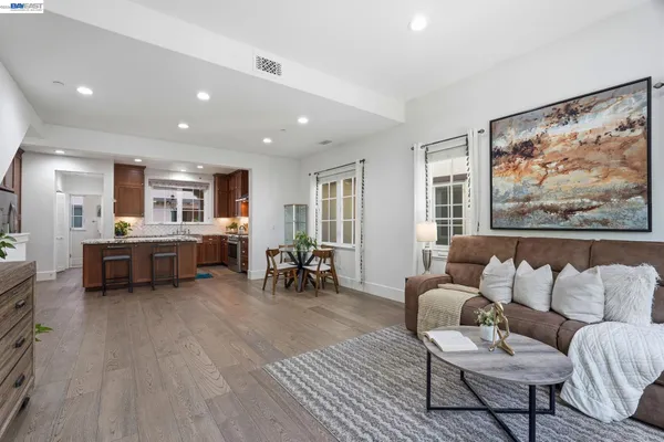 an aerial view of residential houses with outdoor space and swimming pool