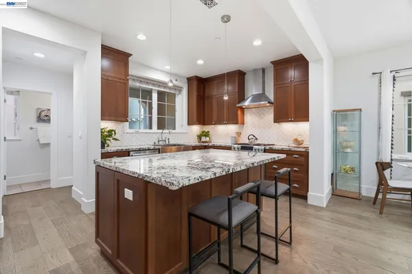 front view of a brick house with a yard