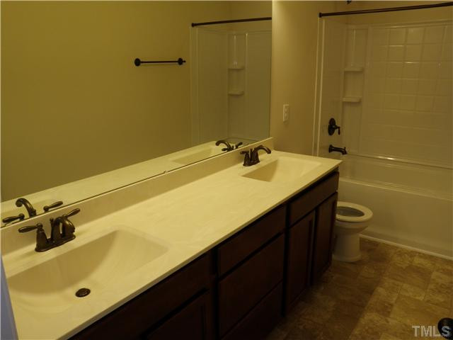 4854 Inwood Road Raleigh, NC 27603 - Photo 16 of 20 1 of the 2 other full baths upstairs. Both feature dual raised vanities and upgraded rectangular bowls!