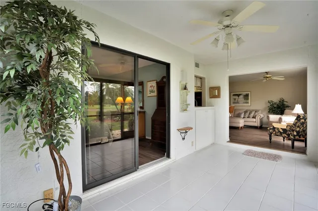 a view of a livingroom with furniture and a potted plant