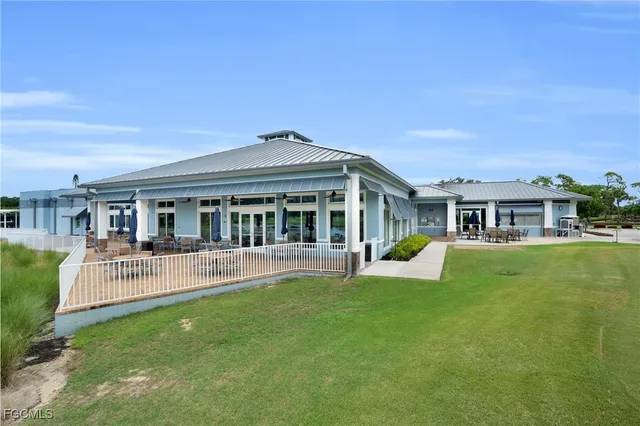 an aerial view of residential houses and outdoor space