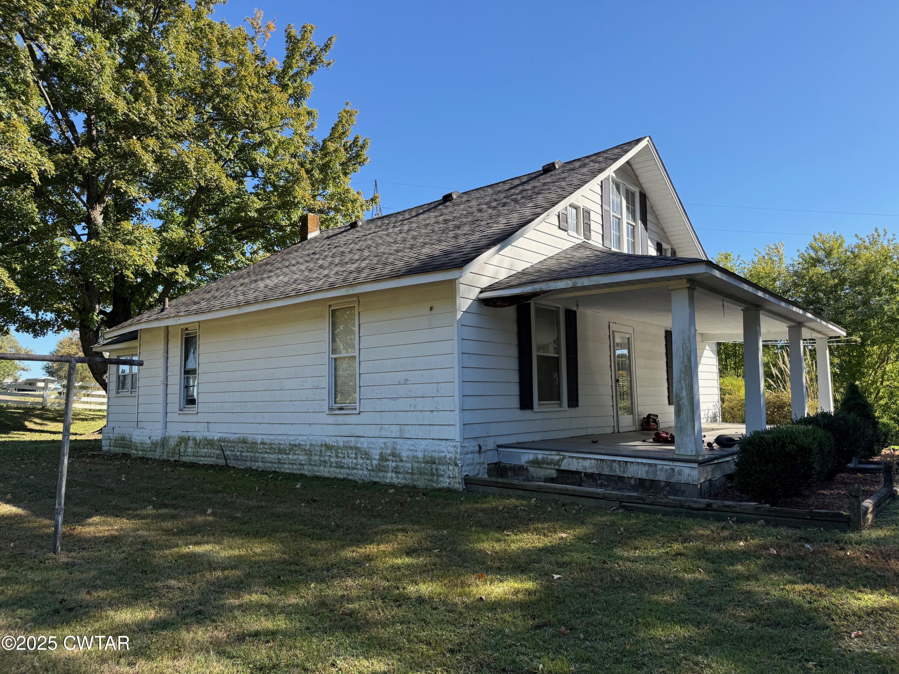 3794 Roellen Newbern Road Newbern, TN 38059 - Photo 13 of 25 a front view of a house with garden