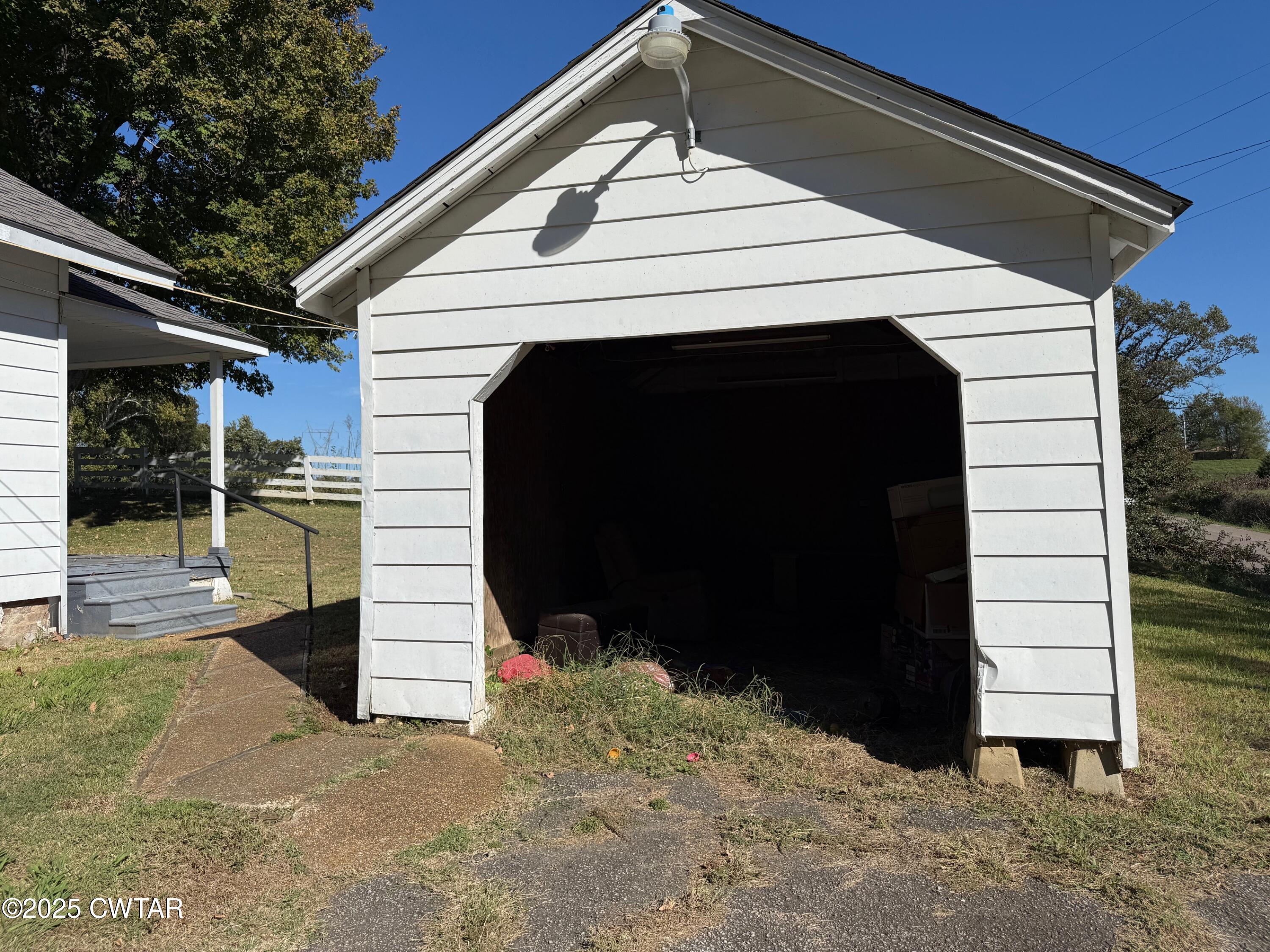3794 Roellen Newbern Road Newbern, TN 38059 - Photo 15 of 25 a view of a house with a door