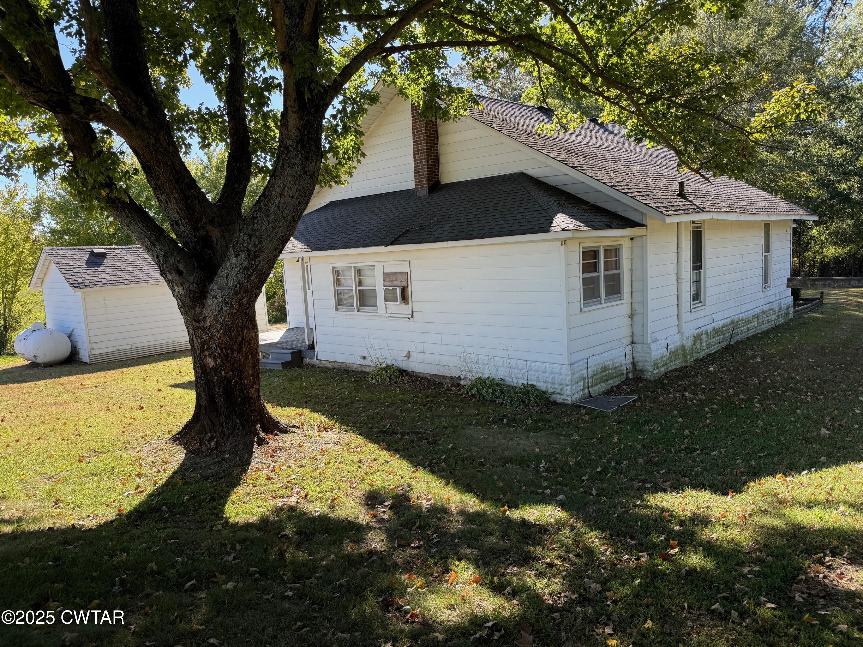 3794 Roellen Newbern Road Newbern, TN 38059 - Photo 18 of 25 a view of a back yard of the house