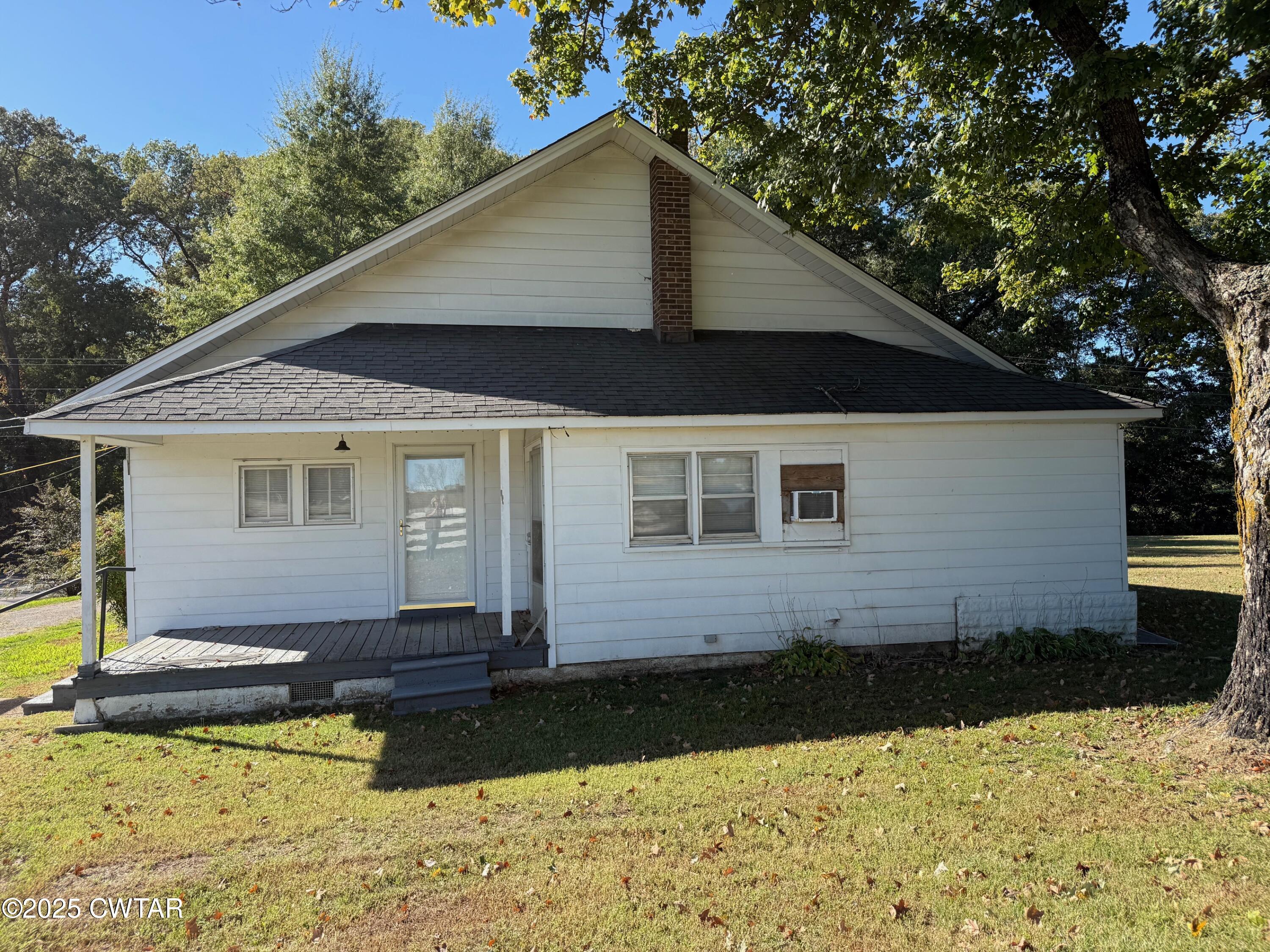 3794 Roellen Newbern Road Newbern, TN 38059 - Photo 19 of 25 a front view of a house with a yard
