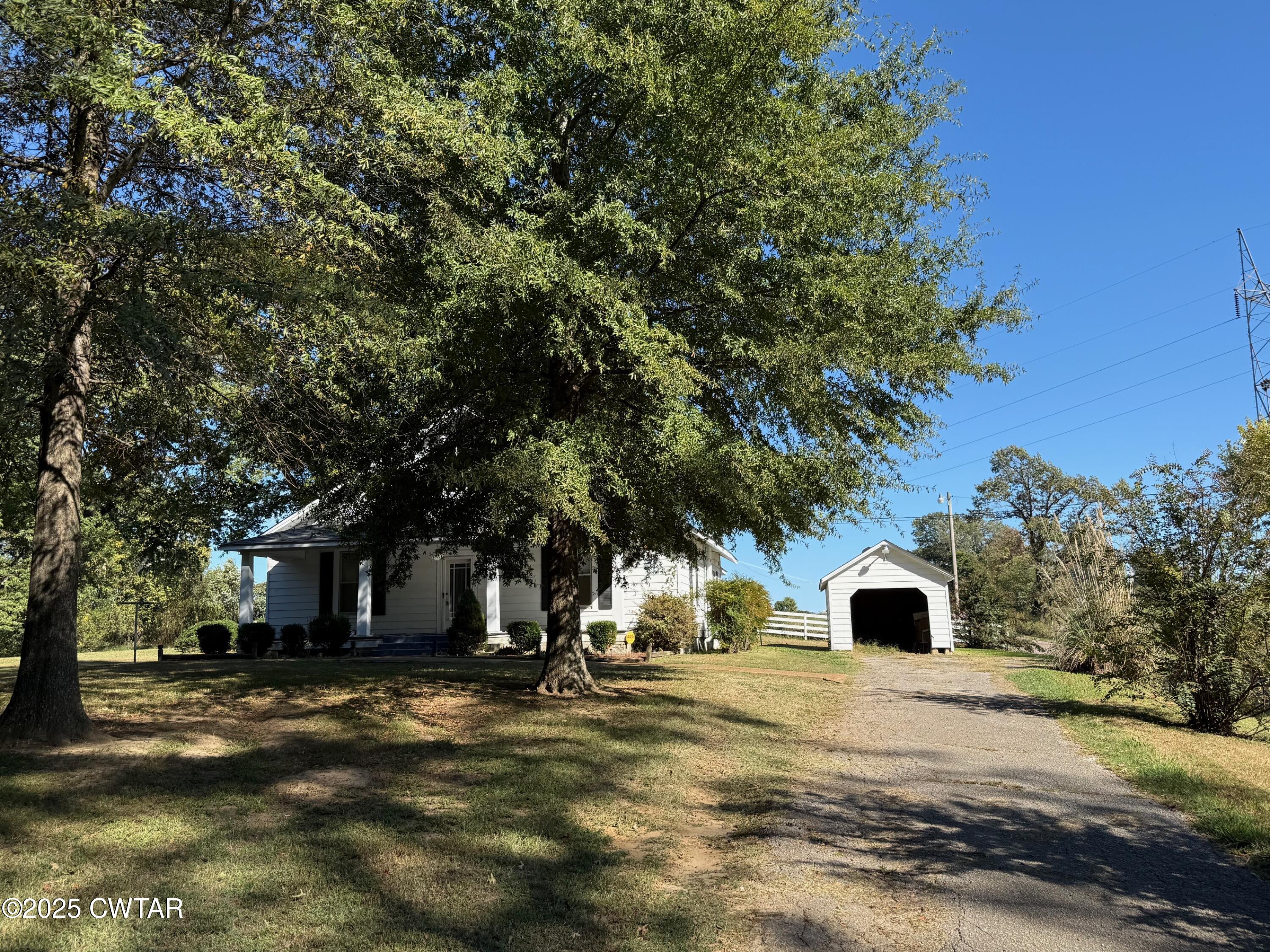 3794 Roellen Newbern Road Newbern, TN 38059 - Photo 23 of 25 a view of road with large trees
