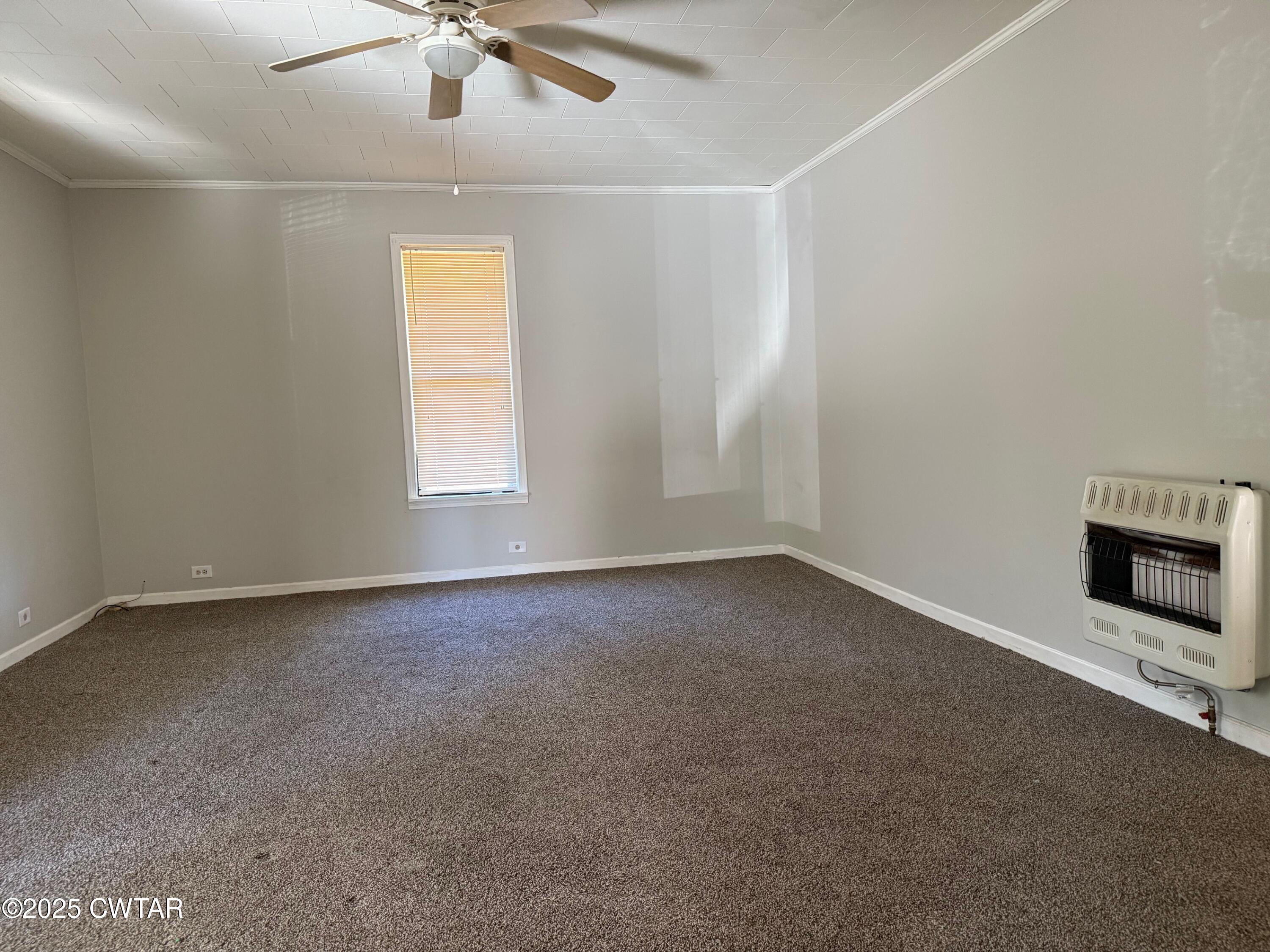 3794 Roellen Newbern Road Newbern, TN 38059 - Photo 4 of 25 an empty room with a ceiling fan and window