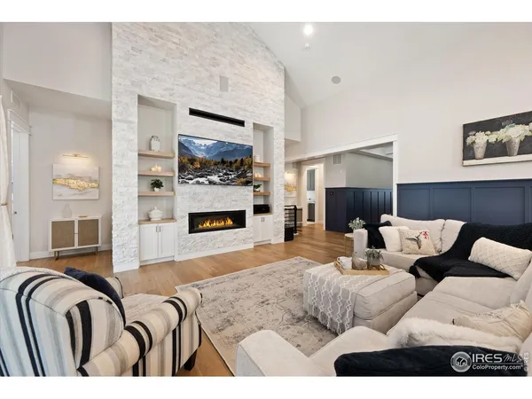 a living room with furniture fireplace and flat screen tv