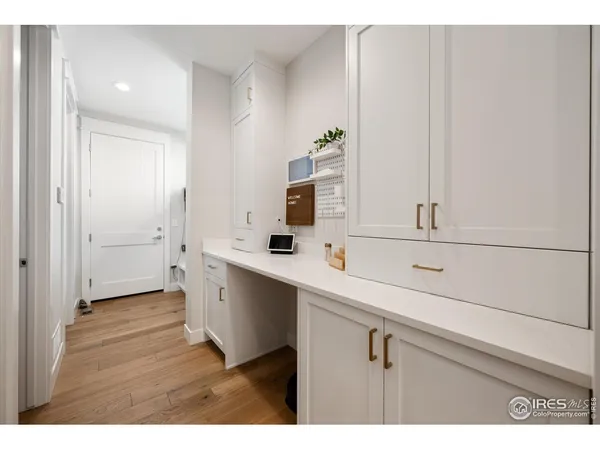 a view of cabinets with wooden floor