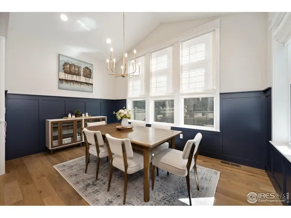 a view of a dining room with furniture and a window